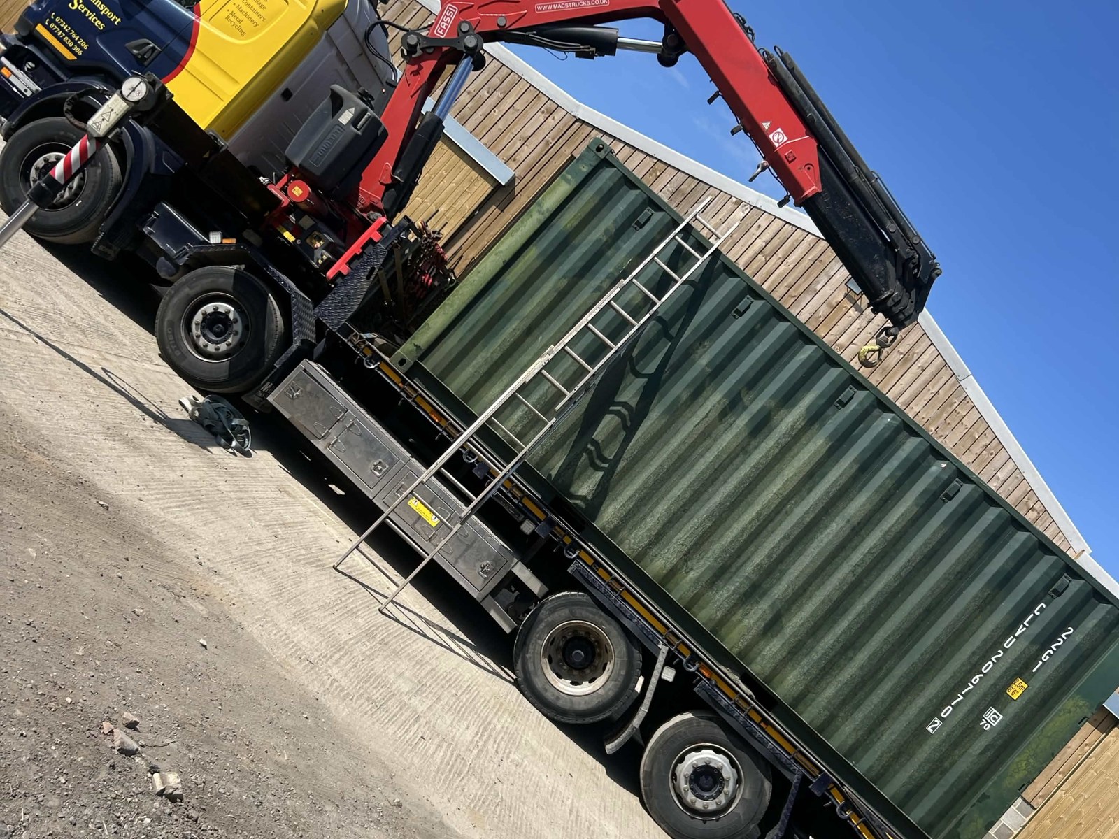 HIAB truck delivering shipping container